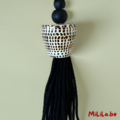 Tassel van katoenkoord en schelpen in boho interieurstijl