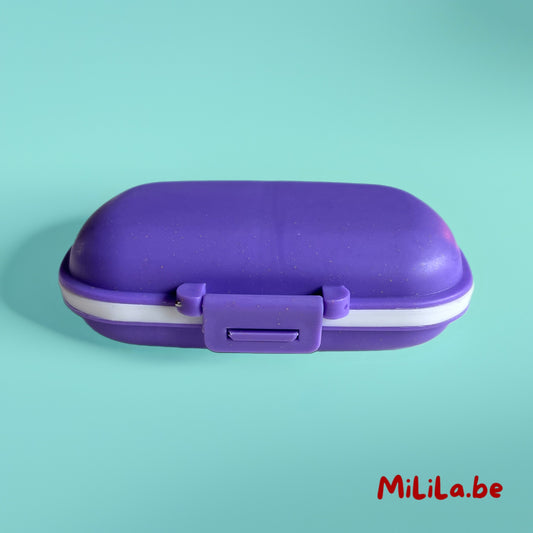 Compact paars pillendoosje gesloten